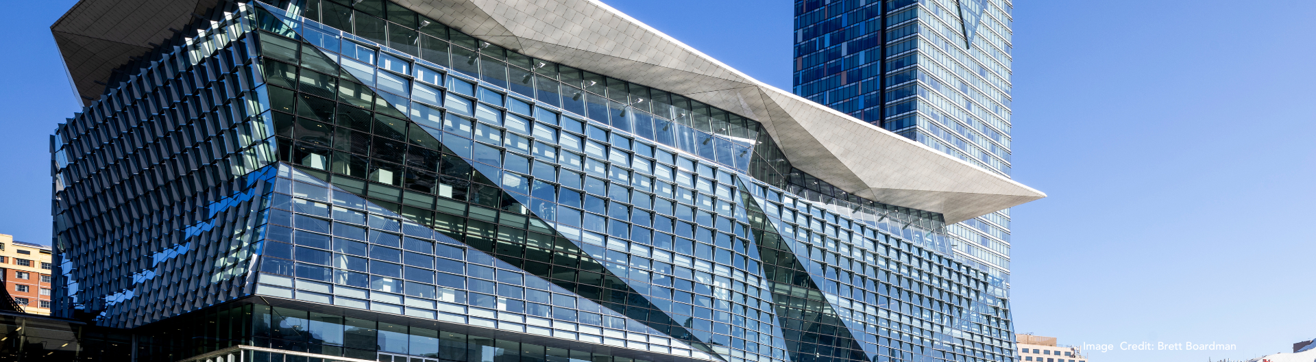 Exterior Image of ICC Sydney's Convention Centre on a blue day.