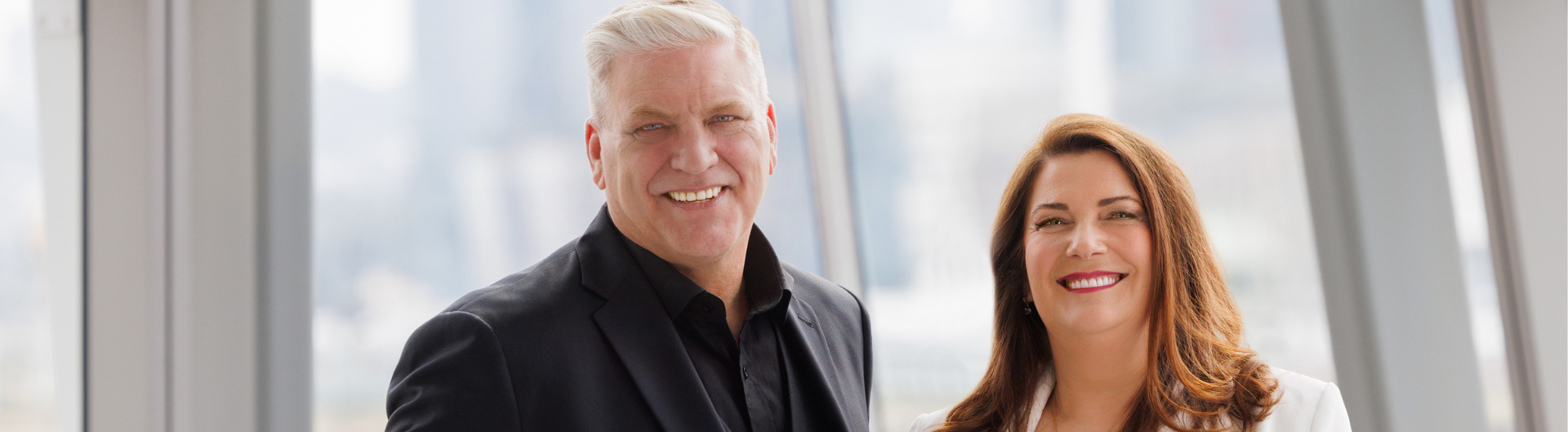 Adam Mather Brown and Beverley Parker pose for headshot at ICC Sydney's Convention Centre