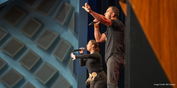 KARI singers singing to crowd in ICC Sydney's Darling Harbour Theatre