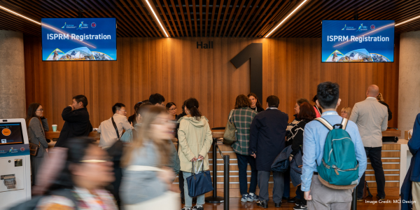 ISPRM at ICC Sydney - attendees lining up to register at ICC Sydney's Exhibition Centre.