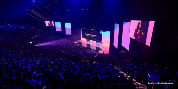 Case Study Images (2) AWS Summit at ICC Sydney Theatre featuring a display of LED screens and a crowd looking at the stage.