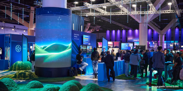 Case Study Images (5) Amazon Web Services Case study image featuring an LED wrap around a pillar of a green hill